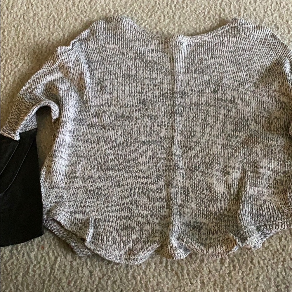 Wide neck sweater with leather lower sleeves